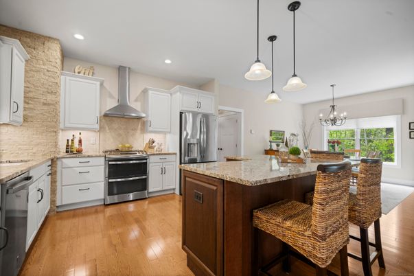 Chandelier, Dining room, Interior, Kitchen, Pendant Lights, Recessed Lighting, Stainless Steel Appliances, Wood Texture Flooring