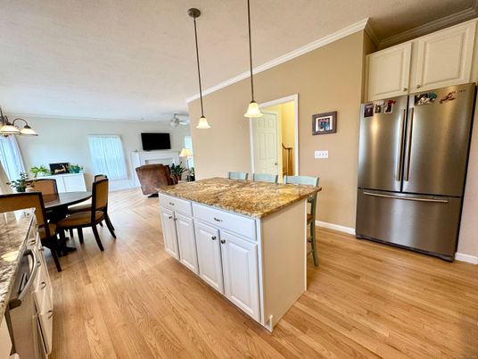 Dining room, Fireplace, Interior, Kitchen, Pendant Lights, Stainless Steel Appliances, Wood Texture Flooring
