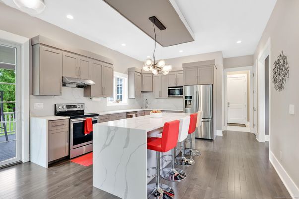 Chandelier, Interior, Kitchen, Pendant Lights, Recessed Lighting, Stainless Steel Appliances, Wood Texture Flooring