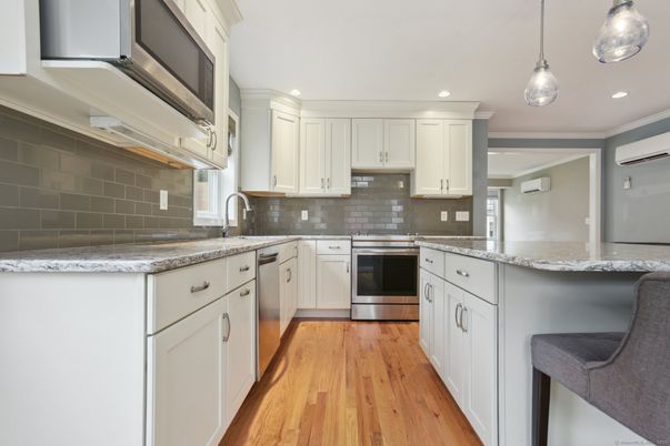 Interior, Kitchen, Pendant Lights, Recessed Lighting, Stainless Steel Appliances, Wood Texture Flooring