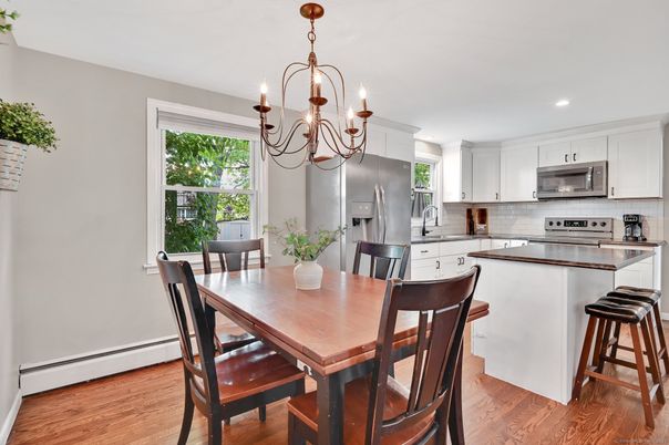 Chandelier, Dining room, Interior, Kitchen, Recessed Lighting, Stainless Steel Appliances, Wood Texture Flooring