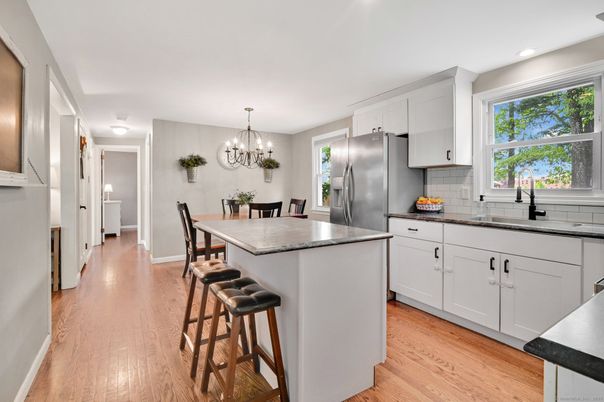 Chandelier, Dining room, Interior, Kitchen, Recessed Lighting, Stainless Steel Appliances, Wood Texture Flooring