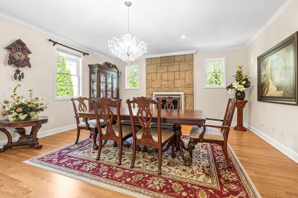 Chandelier, Dining room, Fireplace, Interior, Recessed Lighting, Stone Walls, Wood Texture Flooring