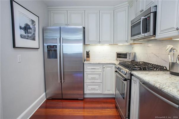 Interior, Kitchen, Marble Walls, Stainless Steel Appliances, Wood Texture Flooring