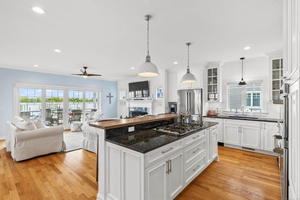 Dining room, Fireplace, Interior, Kitchen, Living room, Pendant Lights, Recessed Lighting, Stainless Steel Appliances, Wood Texture Flooring