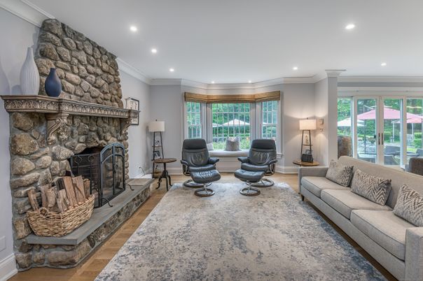 Fireplace, Interior, Living room, Recessed Lighting, Stone Walls, Wood Texture Flooring