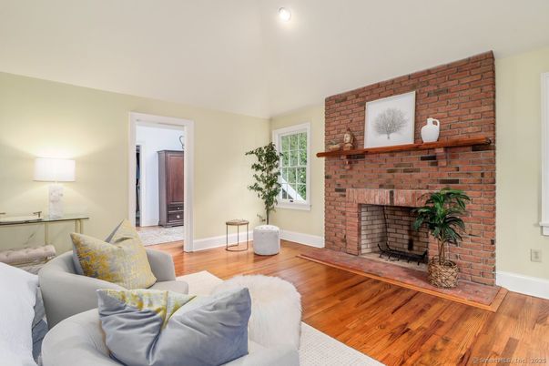 Fireplace, Interior, Living room, Recessed Lighting, Stone Walls, Wood Texture Flooring