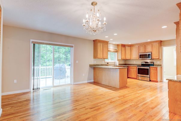 Chandelier, Interior, Kitchen, Recessed Lighting, Stainless Steel Appliances, Wood Texture Flooring