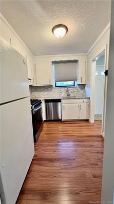 Interior, Kitchen, Marble Walls, Stainless Steel Appliances, Wood Texture Flooring