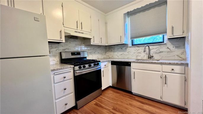 Interior, Kitchen, Marble Walls, Stainless Steel Appliances, Wood Texture Flooring