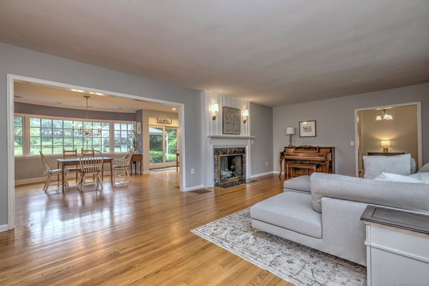 Dining room, Fireplace, Interior, Living room, Recessed Lighting, Wood Texture Flooring