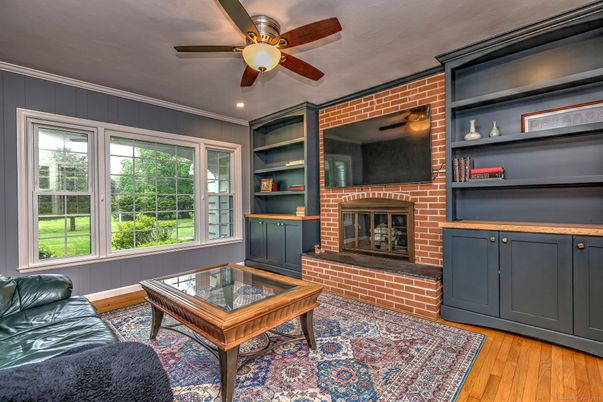 Fireplace, Interior, Living room, Recessed Lighting, Stone Walls, Wood Texture Flooring