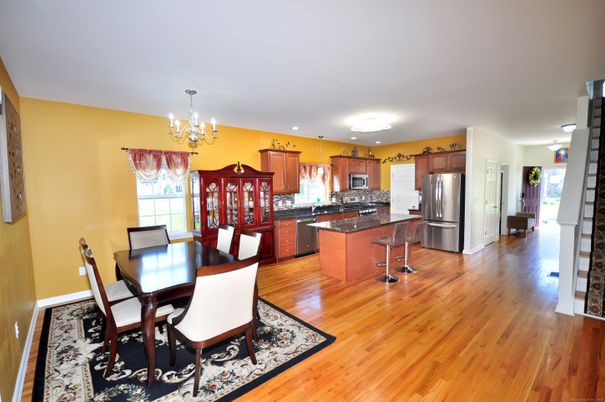 Chandelier, Dining room, Interior, Kitchen, Stainless Steel Appliances, Wood Texture Flooring