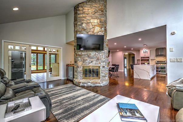 Dining room, Fireplace, Interior, Kitchen, Living room, Recessed Lighting, Stone Walls, Wood Texture Flooring