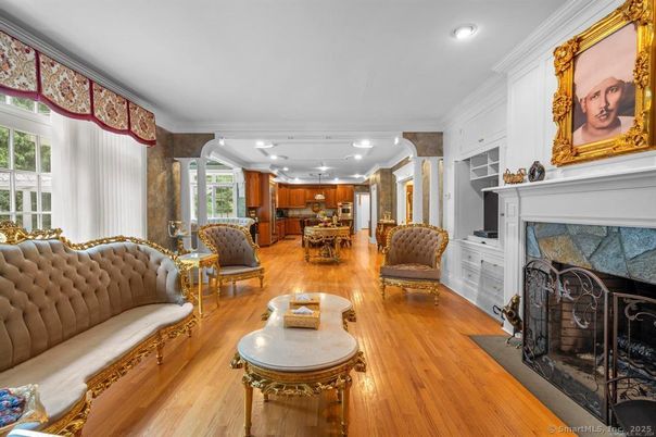 Dining room, Fireplace, Interior, Living room, Recessed Lighting, Wood Texture Flooring