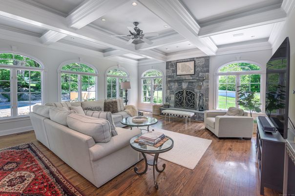 Fireplace, Interior, Living room, Recessed Lighting, Stone Walls, Wood Texture Flooring