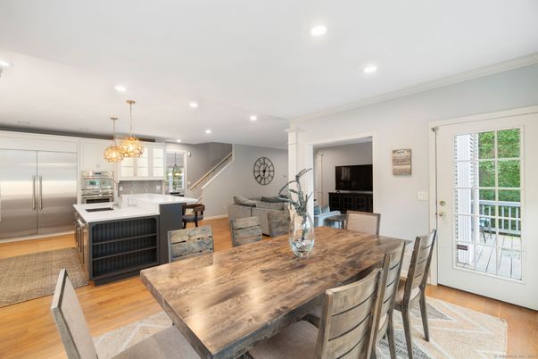 Chandelier, Dining room, Interior, Kitchen, Recessed Lighting, Stainless Steel Appliances, Wood Texture Flooring