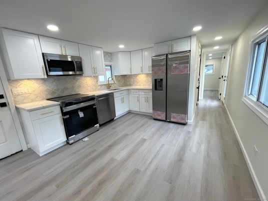 Interior, Kitchen, Recessed Lighting, Stainless Steel Appliances, Wood Texture Flooring