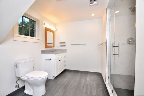Bathroom, Glass Shower, Interior, Marble Walls, Recessed Lighting, Wood Texture Flooring