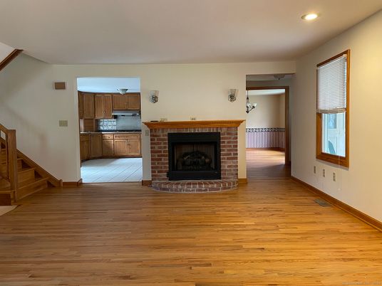 Empty room, Fireplace, Interior, Kitchen, Recessed Lighting, Wood Texture Flooring