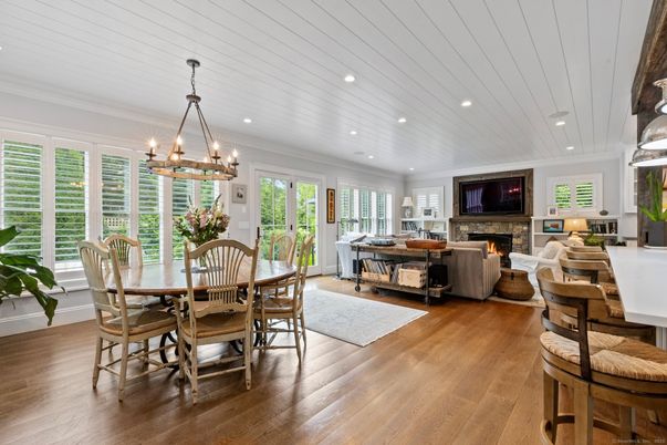 Chandelier, Dining room, Fireplace, Interior, Living room, Pendant Lights, Recessed Lighting, Wood Texture Flooring