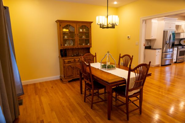 Chandelier, Dining room, Interior, Kitchen, Pendant Lights, Recessed Lighting, Stainless Steel Appliances, Wood Texture Flooring