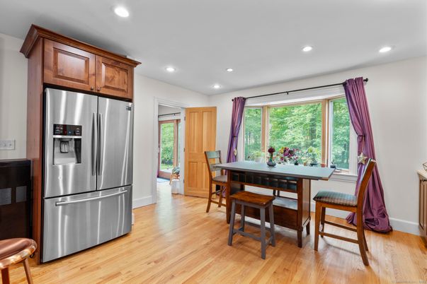 Dining room, Interior, Kitchen, Recessed Lighting, Stainless Steel Appliances, Wood Texture Flooring