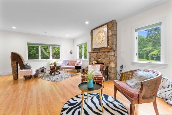Fireplace, Interior, Living room, Recessed Lighting, Stone Walls, Wood Texture Flooring