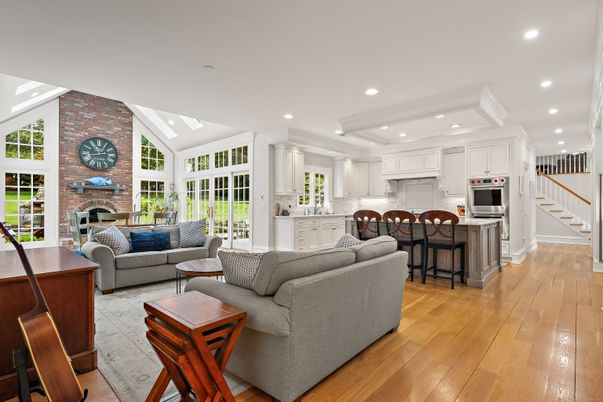 Fireplace, Interior, Kitchen, Living room, Recessed Lighting, Stainless Steel Appliances, Stone Walls, Wood Texture Flooring