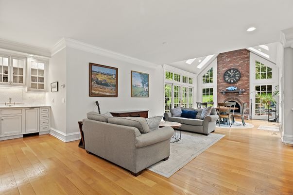 Fireplace, Interior, Living room, Recessed Lighting, Stone Walls, Wood Texture Flooring
