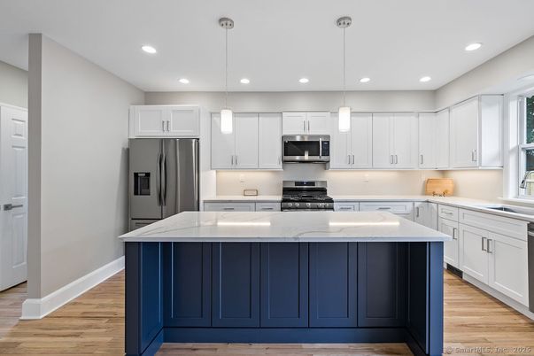 Interior, Kitchen, Pendant Lights, Recessed Lighting, Stainless Steel Appliances, Wood Texture Flooring