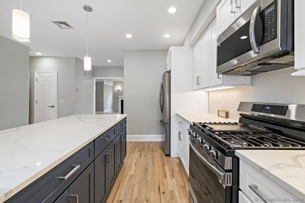 Interior, Kitchen, Pendant Lights, Recessed Lighting, Stainless Steel Appliances, Wood Texture Flooring