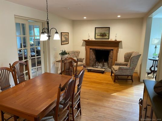 Dining room, Fireplace, Interior, Pendant Lights, Recessed Lighting, Wood Texture Flooring