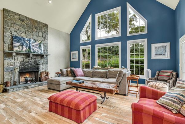 Fireplace, Interior, Living room, Recessed Lighting, Stone Walls, Wood Texture Flooring