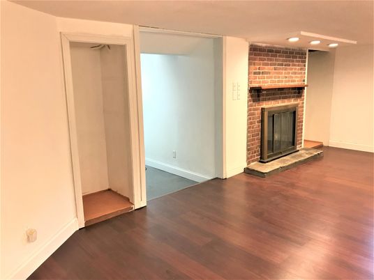 Empty room, Fireplace, Interior, Recessed Lighting, Stone Walls, Wood Texture Flooring