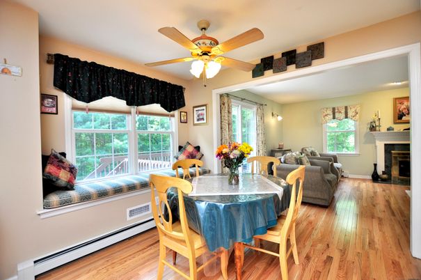 Dining room, Fireplace, Interior, Living room, Recessed Lighting, Wood Texture Flooring