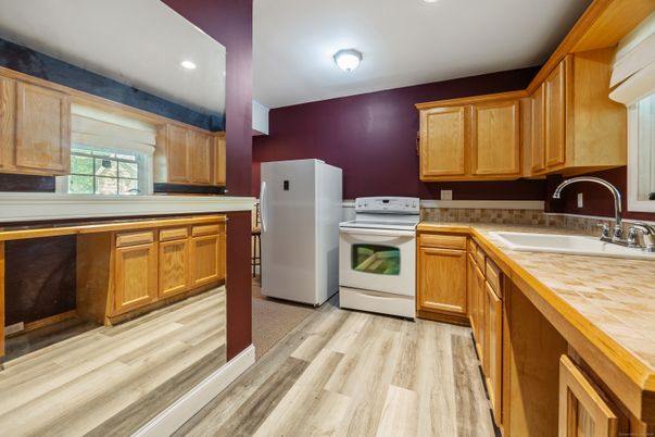 Interior, Kitchen, Recessed Lighting, Tile Countertops, Wood Texture Flooring
