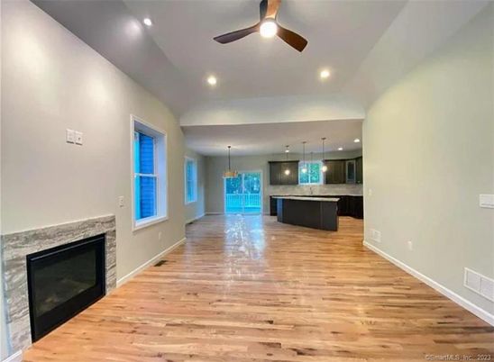 Empty room, Fireplace, Interior, Kitchen, Pendant Lights, Recessed Lighting, Wood Texture Flooring