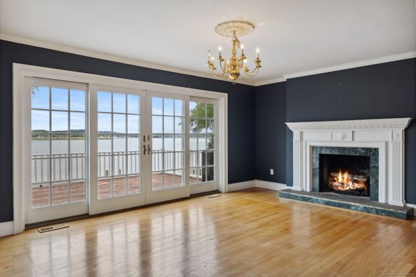 Chandelier, Empty room, Fireplace, Interior, Water, Wood Texture Flooring