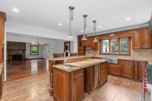 Chandelier, Fireplace, Interior, Kitchen, Pendant Lights, Recessed Lighting, Wood Texture Flooring