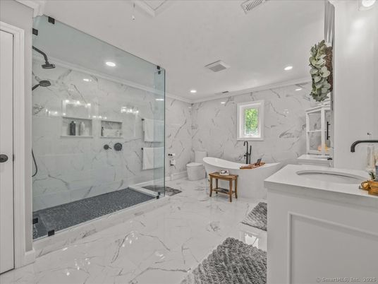 Bathroom, Dual Sink Vanities, Free Standing Baths, Glass Shower, Interior, Marble, Marble Walls, Recessed Lighting