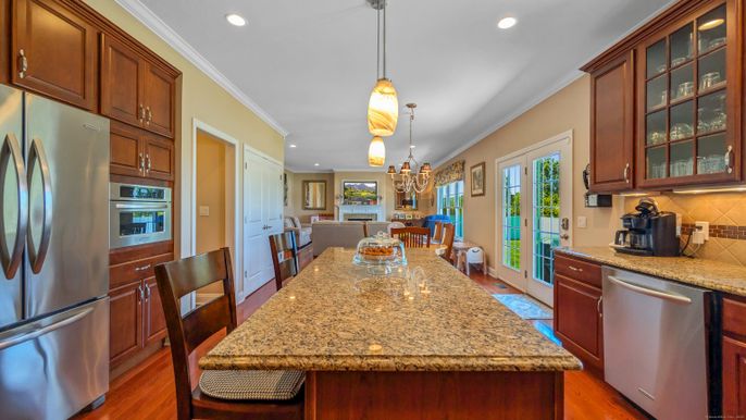Chandelier, Dining room, Interior, Kitchen, Pendant Lights, Recessed Lighting, Stainless Steel Appliances, Wood Texture Flooring
