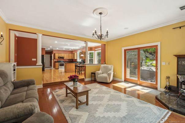 Chandelier, Interior, Kitchen, Living room, Pendant Lights, Recessed Lighting, Stainless Steel Appliances, Wood Texture Flooring