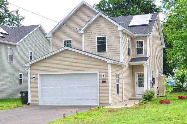 Attached, Exterior, Facade, Solar Panels, Rowhouse