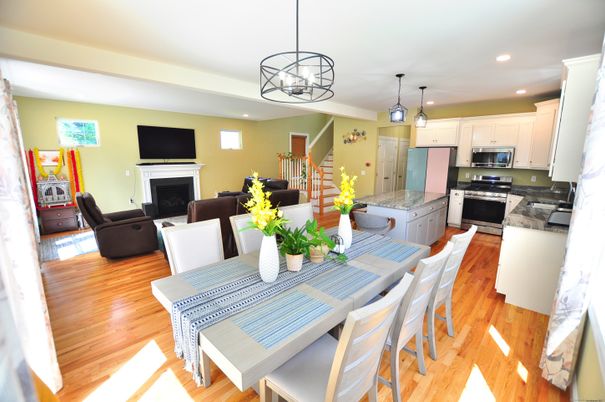 Dining room, Fireplace, Interior, Kitchen, Living room, Pendant Lights, Recessed Lighting, Stainless Steel Appliances, Wood Texture Flooring