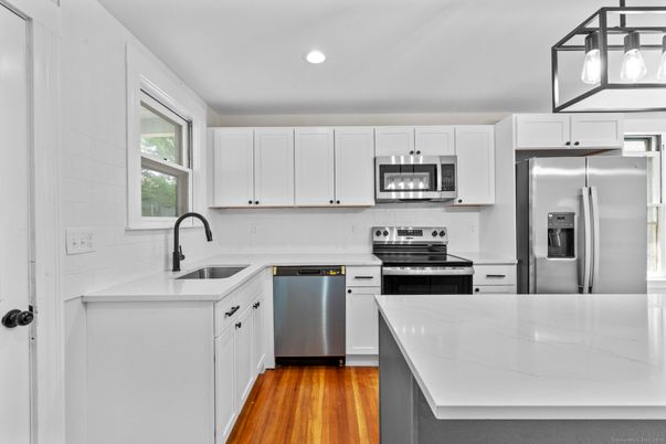 Interior, Kitchen, Pendant Lights, Recessed Lighting, Stainless Steel Appliances, Wood Texture Flooring