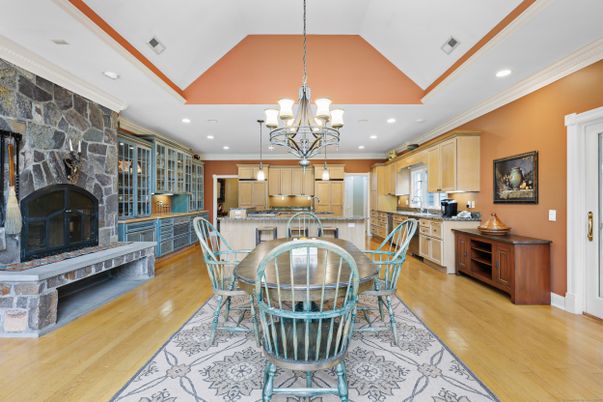 Chandelier, Dining room, Fireplace, Interior, Kitchen, Pendant Lights, Recessed Lighting, Stone Walls, Wood Texture Flooring