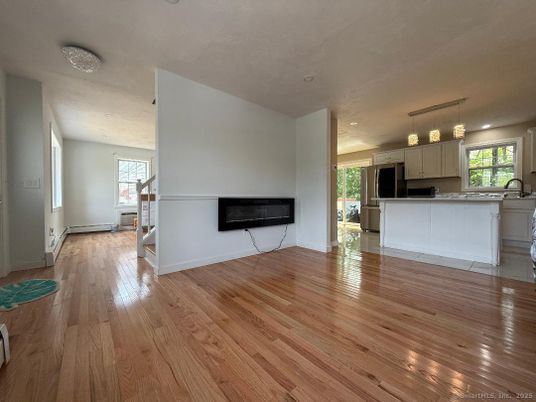 Empty room, Fireplace, Interior, Kitchen, Pendant Lights, Recessed Lighting, Wood Texture Flooring