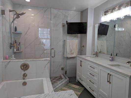 Bathroom, Dual Sink Vanities, Glass Shower, Interior, Marble Walls, Recessed Lighting