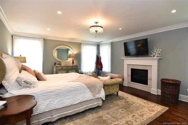 Bedroom, Chandelier, Fireplace, Interior, Recessed Lighting, Wood Texture Flooring